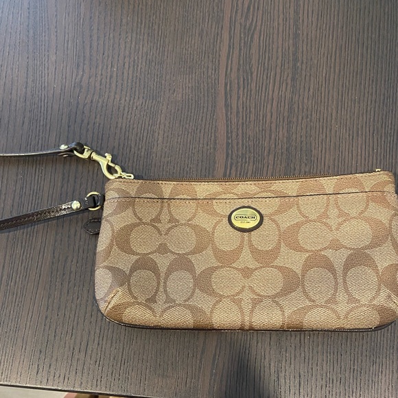 Coach Handbags - Brown with gold hardware Coach wristlet